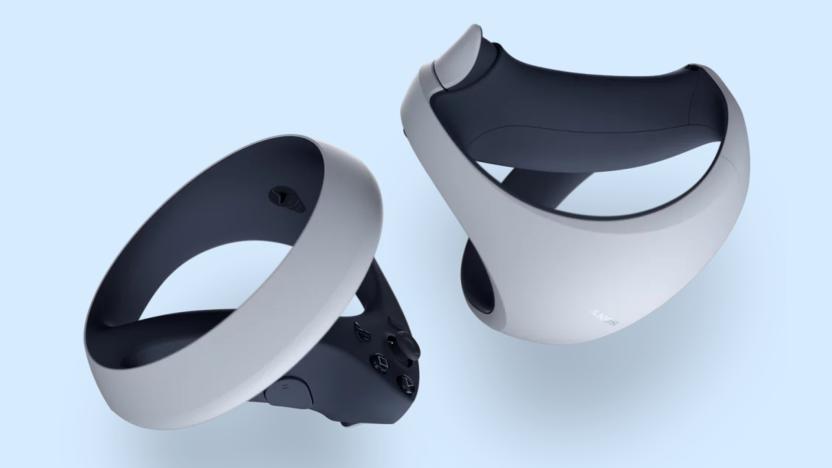 Two PlayStation VR2 Sense controllers are pictured in front of a light blue background