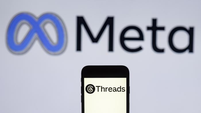 INDIA - 2024/02/12: In this photo illustration, the Threads logo is seen displayed on a mobile phone screen with Meta logo in the background. (Photo Illustration by Idrees Abbas/SOPA Images/LightRocket via Getty Images)