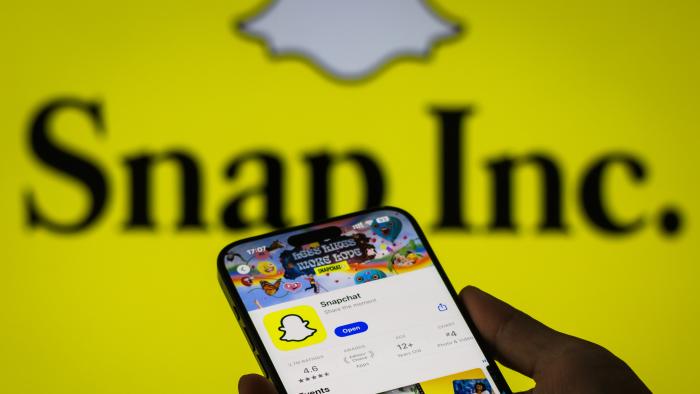 CHONGQING, CHINA - OCTOBER 27: The Snapchat app page is displayed on a smartphone in the Apple App Store in front of the Snap Inc. logo on October 27, 2024 in Chongqing, China. (Photo by Cheng Xin/Getty Images)