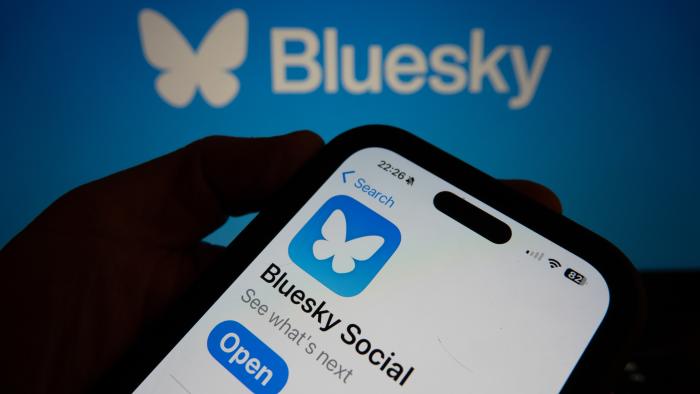 BATH, UNITED KINGDOM - NOVEMBER 17: In this photo illustration a smartphone screen displays the logo of social media app Bluesky on November 17, 2024 in Bath, England. Millions of users have been leaving Elon Musk's social media site X, formerly known as Twitter, and have instead been joining Bluesky, set up by former Twitter founder Jack Dorsey. (Photo by Anna Barclay/Getty Images)