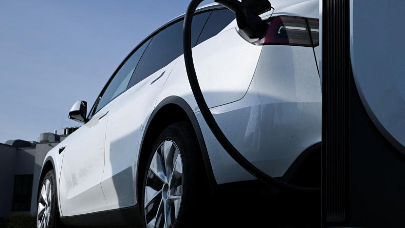 FILE PHOTO: A Tesla car being charged at a Tesla electric vehicle charging station in a car park of the A10 shopping center in Wildau near Berlin, Germany, March 20, 2024. REUTERS/Annegret Hilse/File Photo