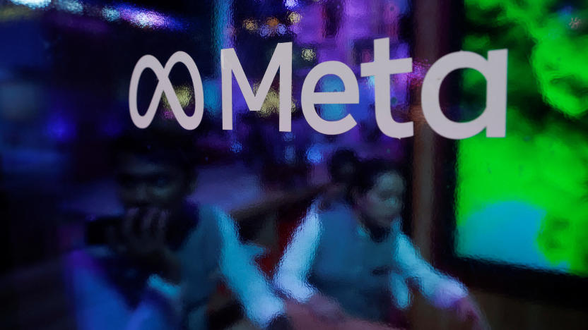 People are seen behind a logo of Meta Platforms, during a conference in Mumbai, India, September 20, 2023. REUTERS/Francis Mascarenhas/File Photo